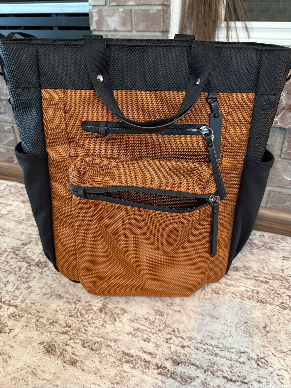 Sherpani multi-wear computer travel bag, burnt orange w/ matching crossbody bag